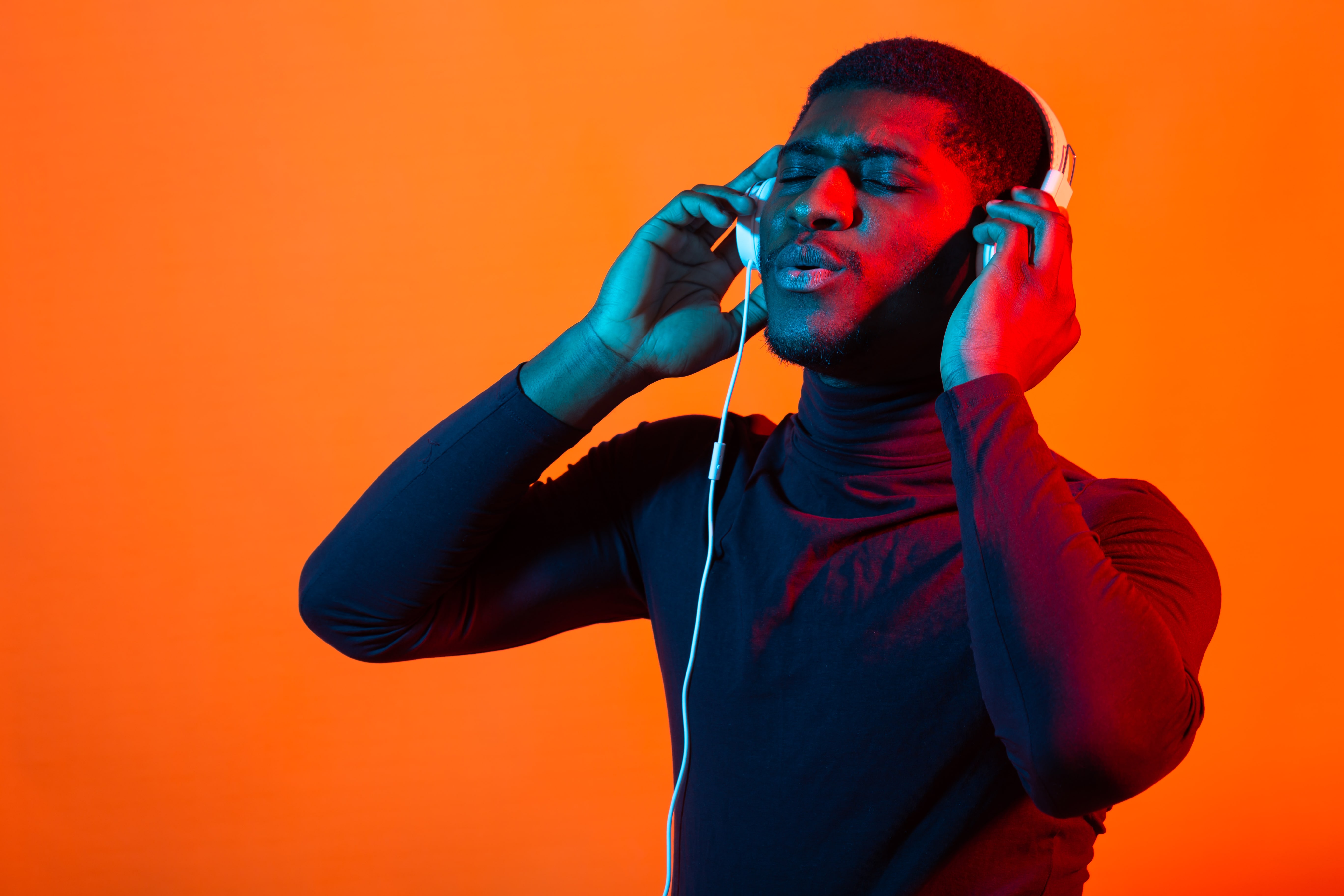 Young man immersed in music with headphones